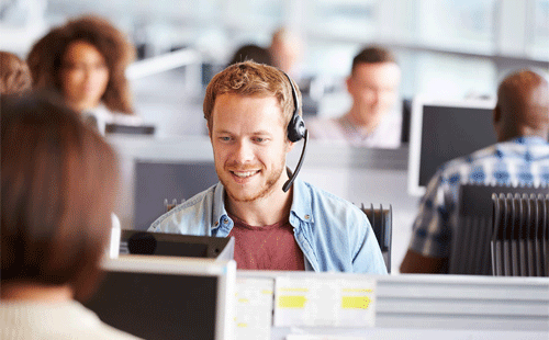 Young man working a call centre